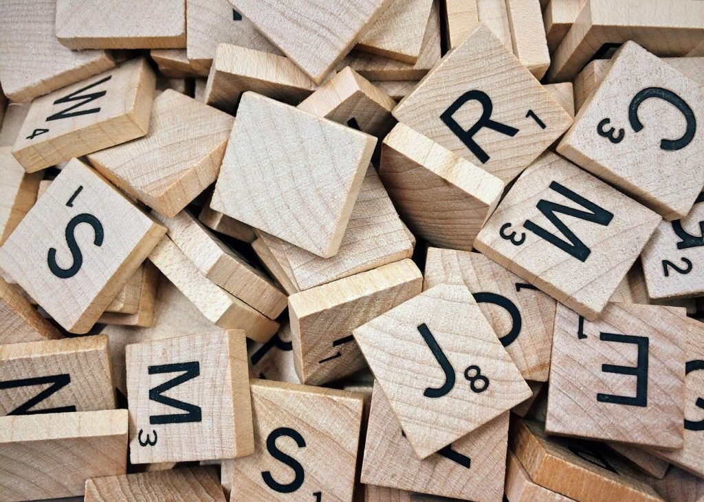 brown scrabble boards with letters