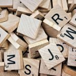 brown scrabble boards with letters